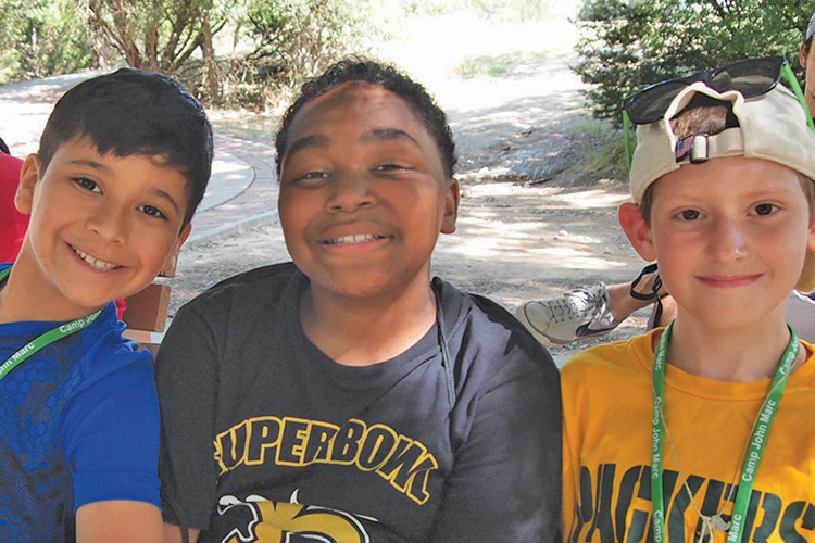 A group of young boys standing next to each other.