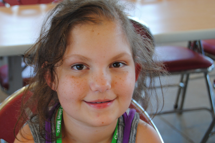 A close up of a young girl with long hair