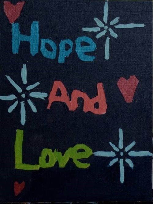 A painting of hope and love written in different colors.