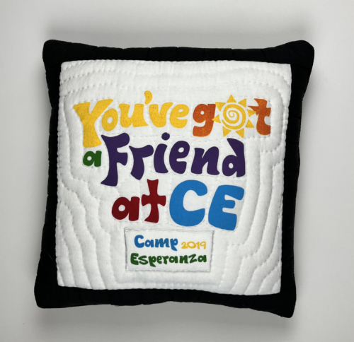 A pillow with the words " you 've got a friend at ce " on it.