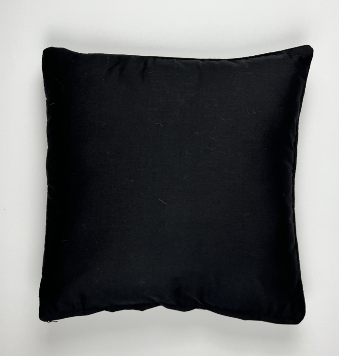 A black pillow with a white background